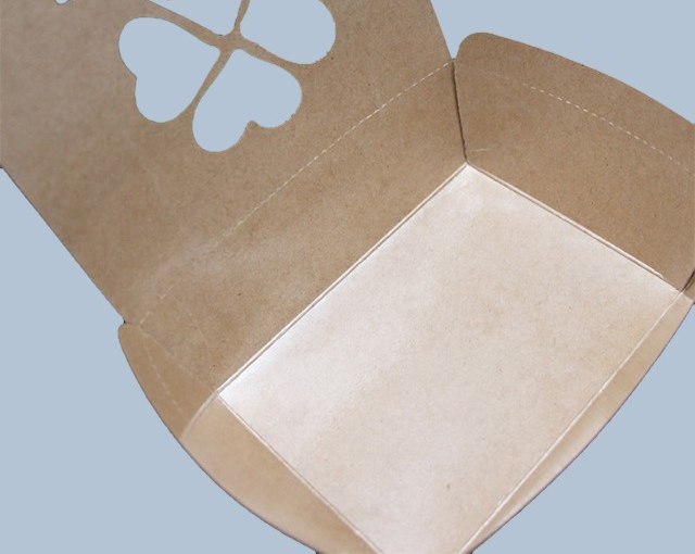 Detail of a natural kraft paper box showing a fitted base